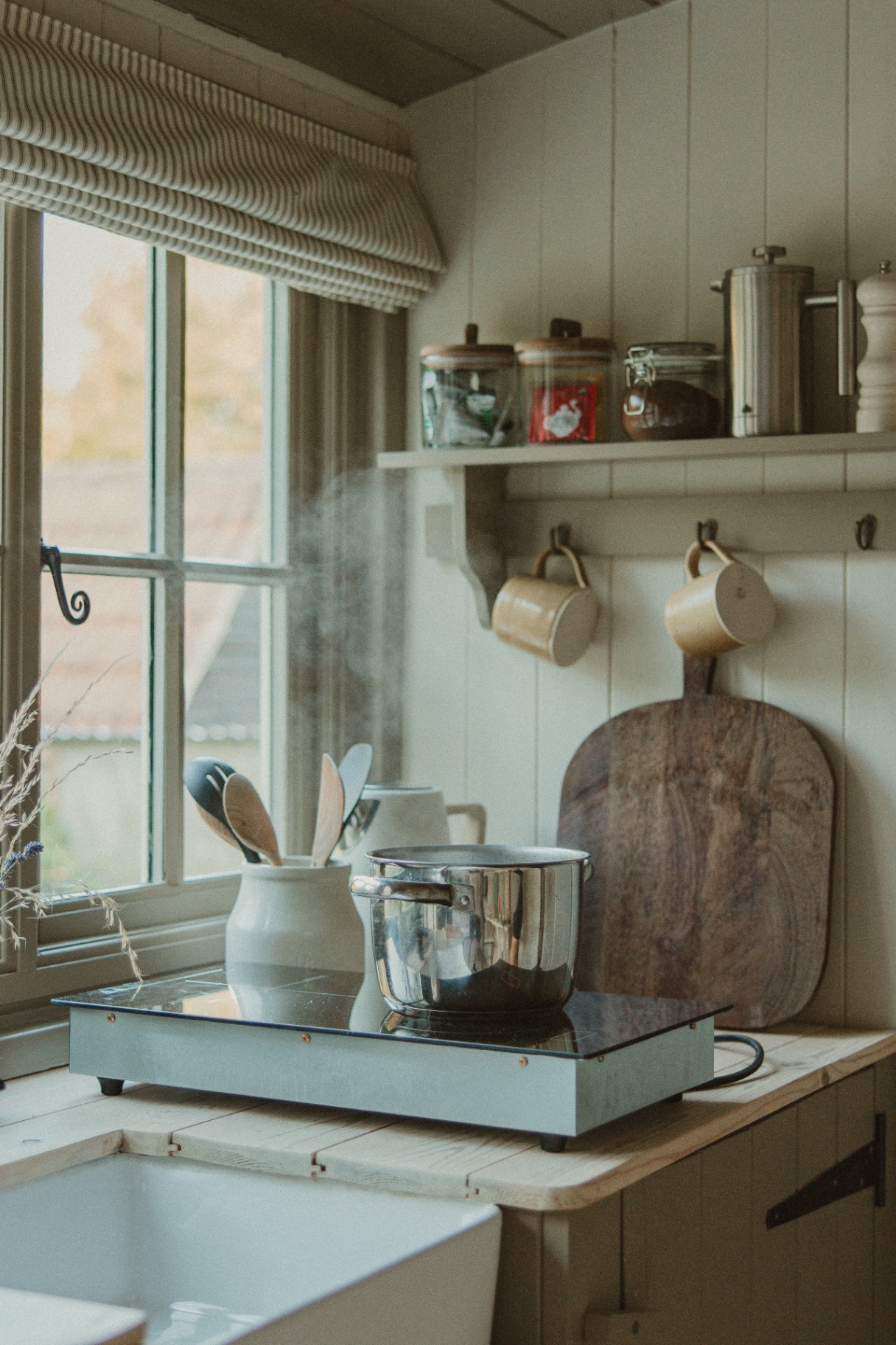 Willow - kitchen with steaming pan, butler sink and open shelf of mugs