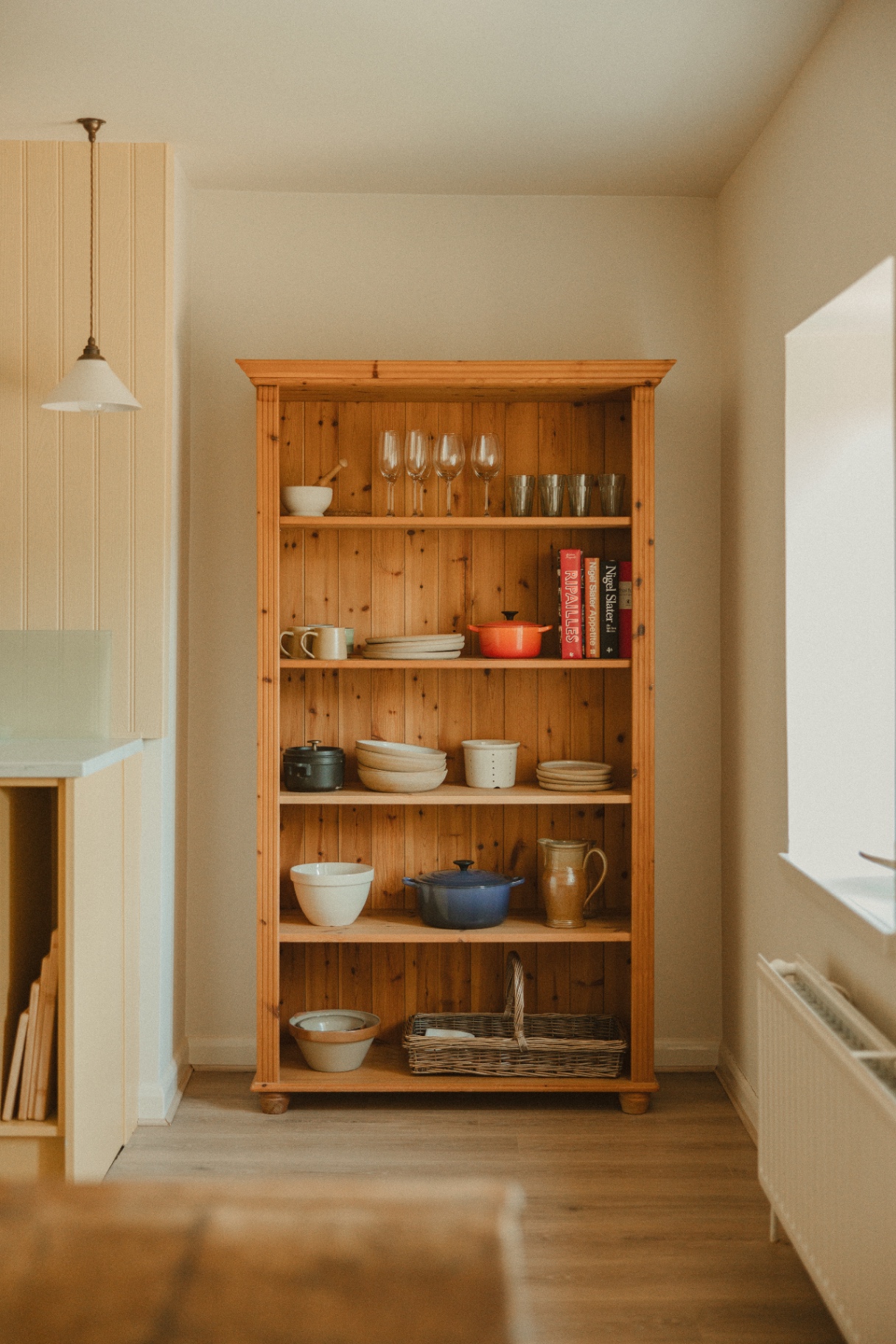The Guesthouse - pine dresser with ceramics, glassware and cookbooks