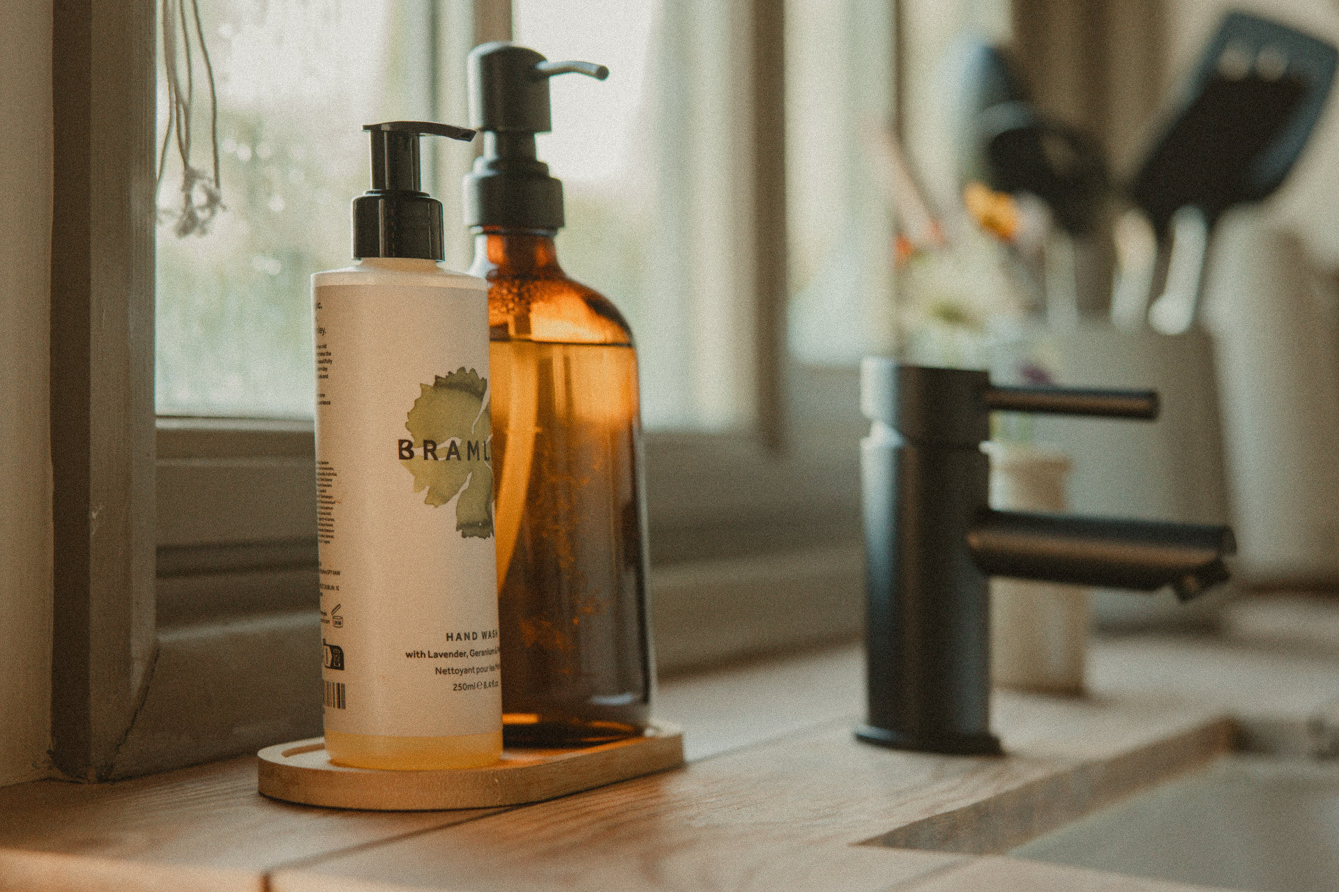 Fern - Bramley hand wash and amber soap dispenser by the kitchen window